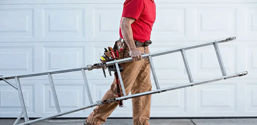 Garage door repair technician arriving with tools and ladder in Baltimore, MD